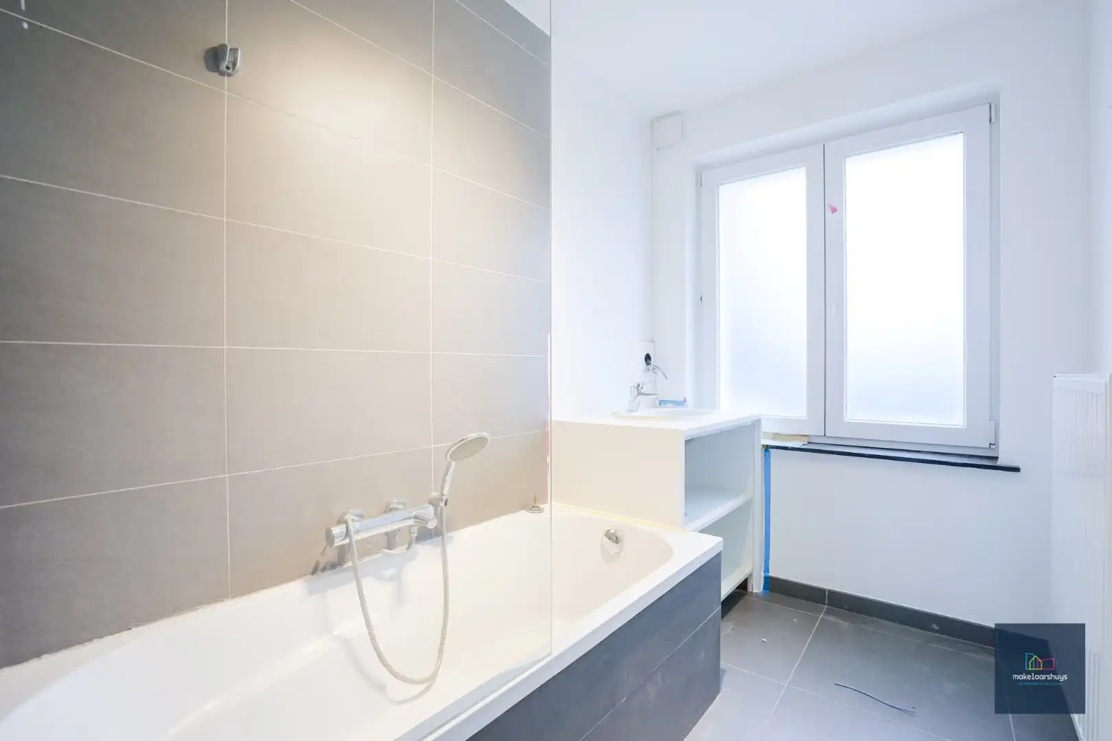 Ruim gelijkvloersappartement met 2 slaapkamers , een  zuidgeorienteerde  tuin en garage foto 10