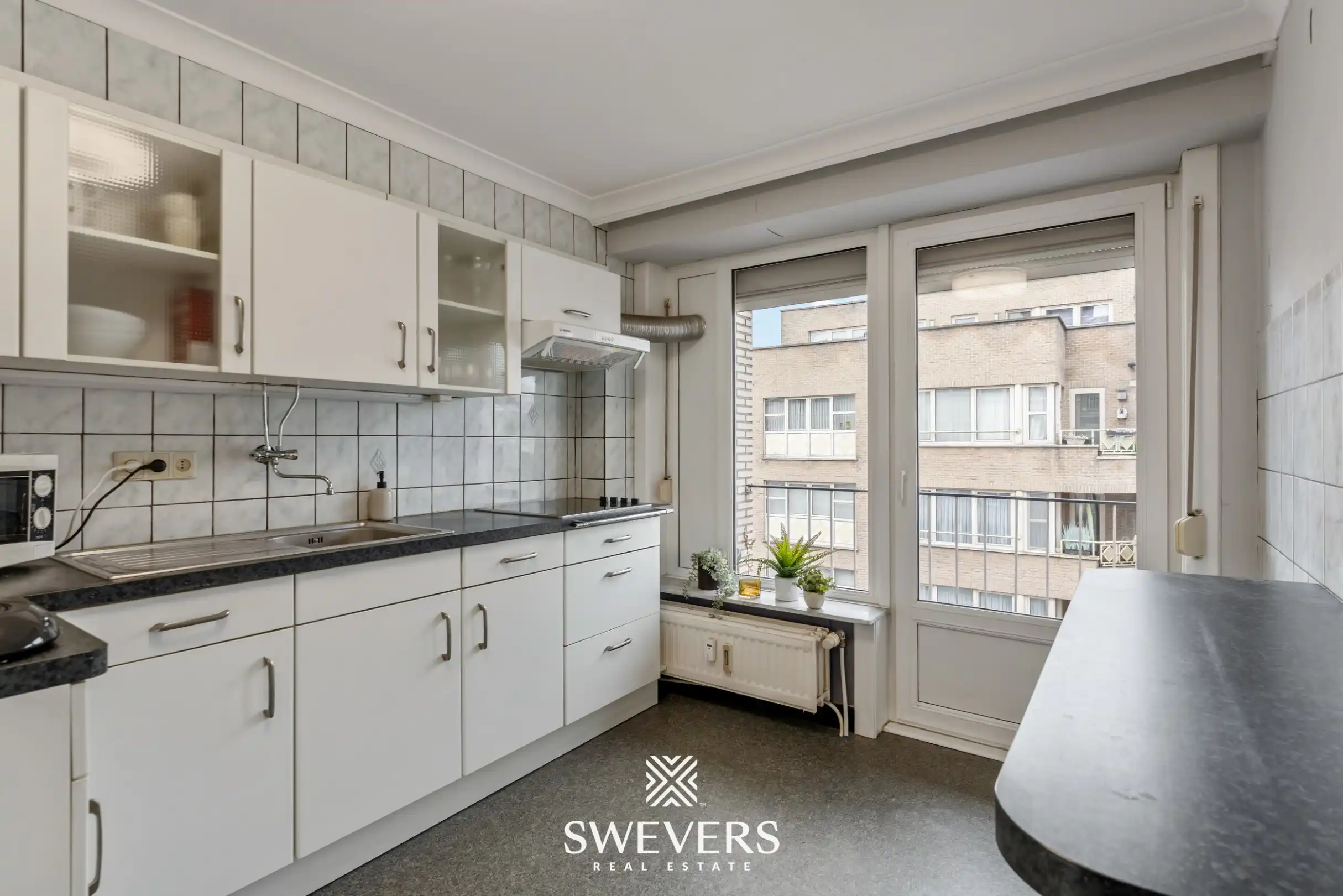 Ruim en lichtrijk 3-slpk appartement met 2 terrasjes in hartje Genk foto 10