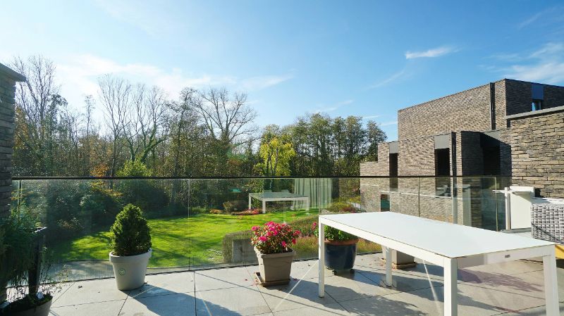 Luxe duplex-appartement 123m² met ruim terras 22m² met mooi zicht op het natuurgebied foto {{pictureIndex}}