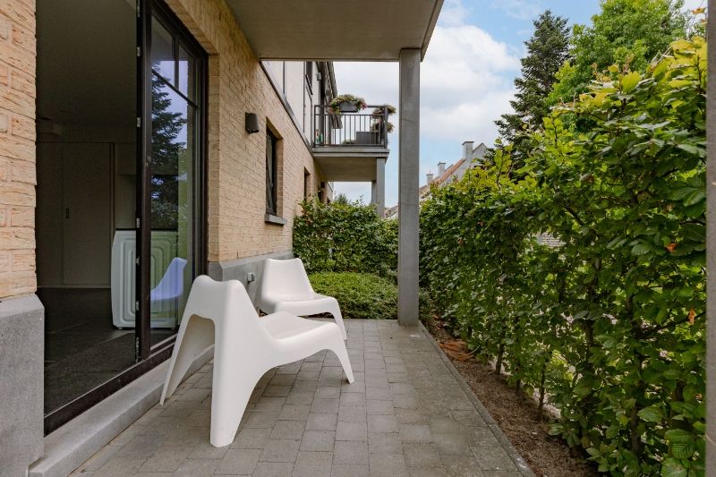 Stijlvol 1-slaapkamer appartement met zonnig terras en tuin foto 14