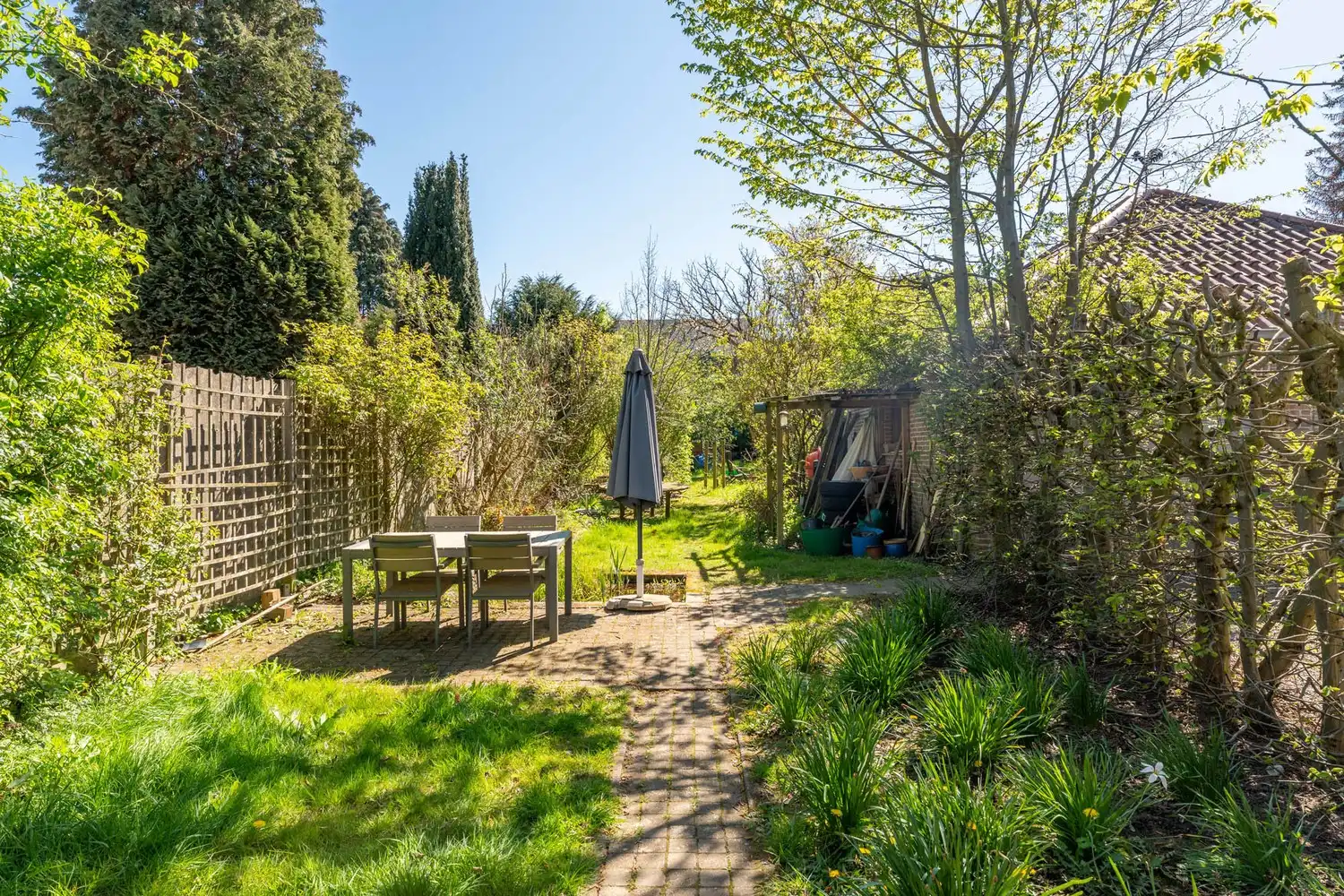 Goed gelegen en energiezuinige woning met 4 slaapkamers, een oprit met een garage en een tuin op de grens van Kessel-Lo en Holsbeek! foto 9