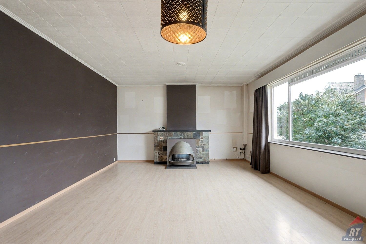 Gelijkvloerse halfopen woning met tuin en renovatiepotentieel in het hart van Sint-Truiden foto 4