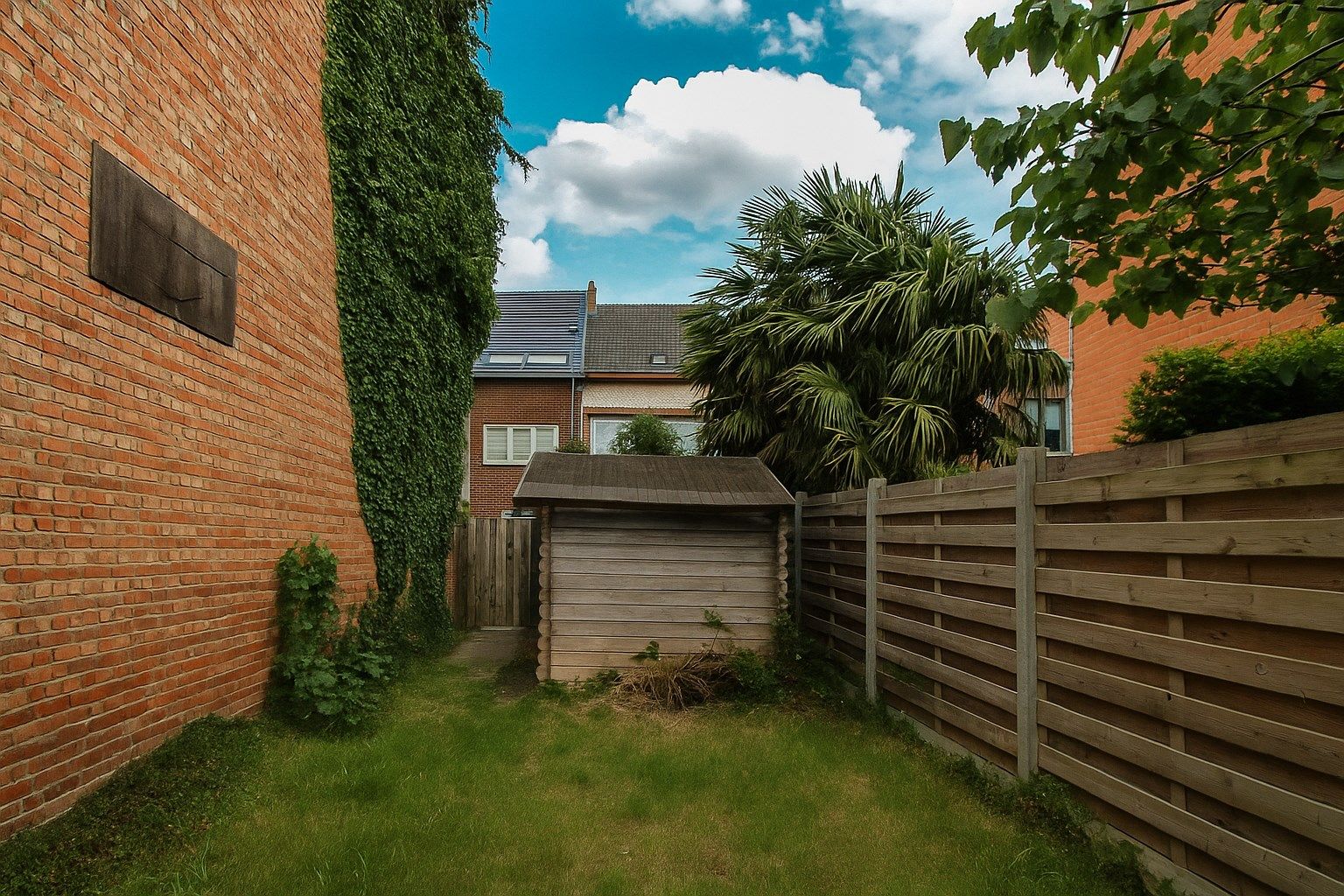 Te koop: Ruime en charmante halfopen bebouwing met uitgestrekte tuin, optie tot vijf slaapkamers en veel renovatiepotentieel in het centrum van Sint-Niklaas foto 16