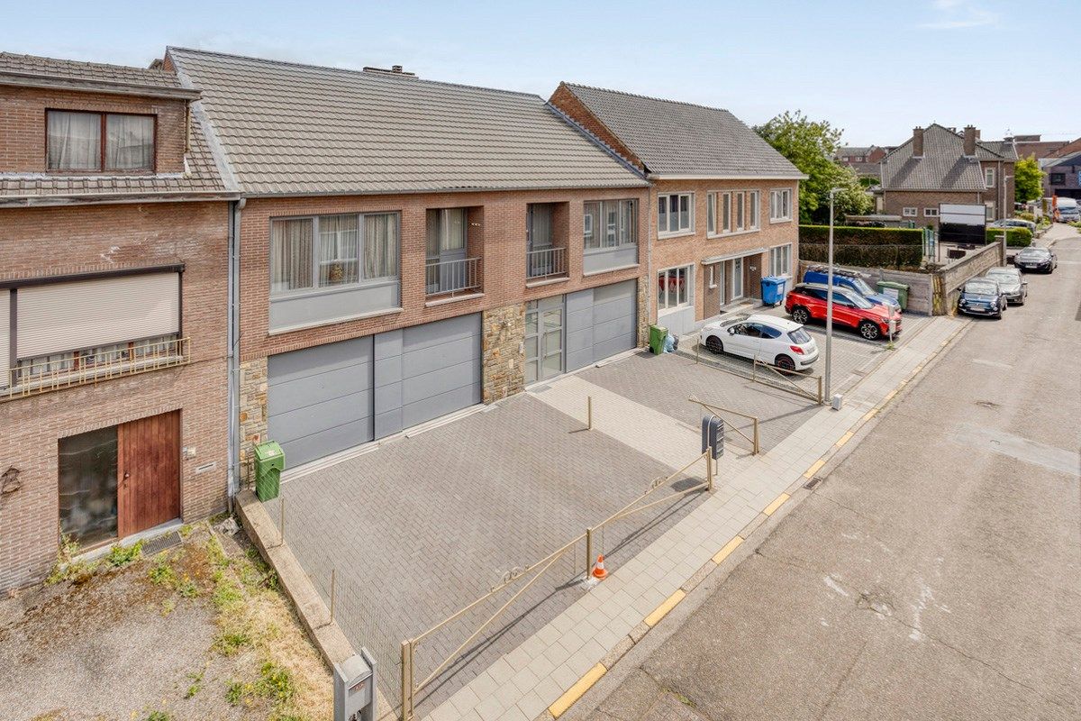 Opbrengsteigendom met 3 appartementen, garages en tuin foto 30