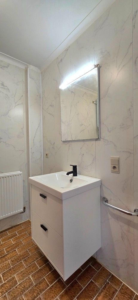 Instapklaar 2-slaapkamer appartement met garage, autostaanplaats en kelderberging foto 13