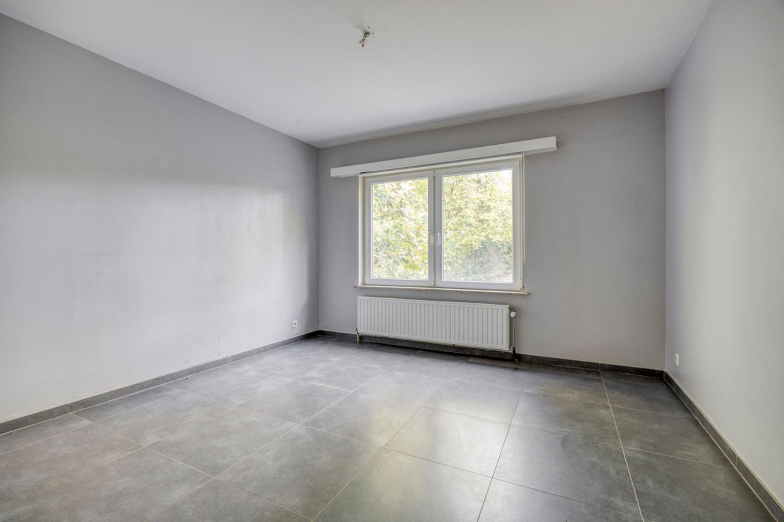 Instapklaar gelijkvloers appartement met eigen tuin foto 9