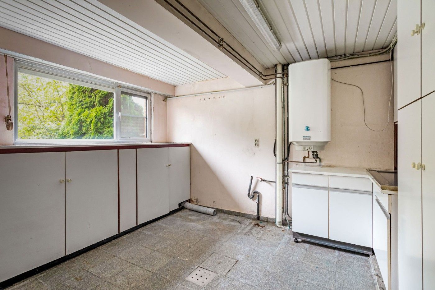 Centraal gelegen, op te frissen woning met 2 à 3 slpk., inpandige garage en tuin foto 26