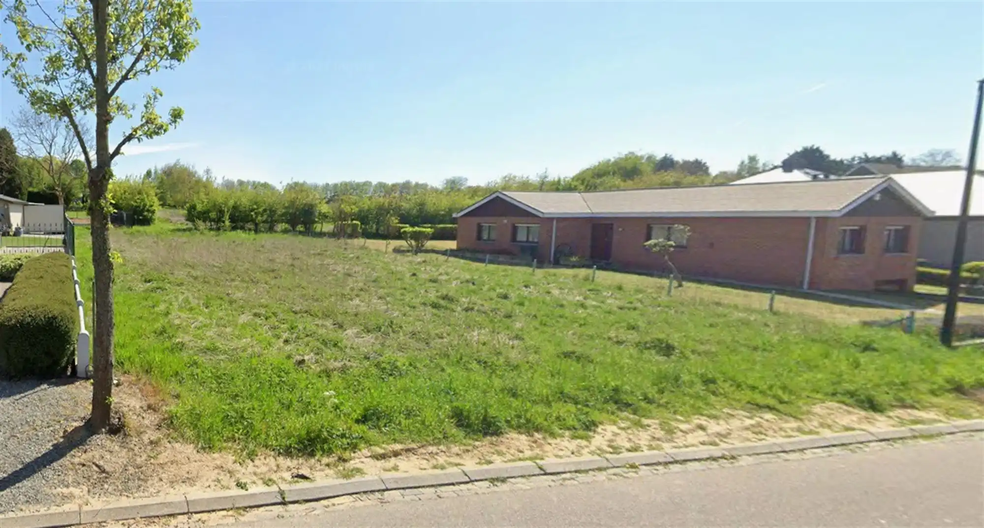 Exclusieve bouwgrond te koop in een doodlopende wijk te Wemmel foto {{pictureIndex}}