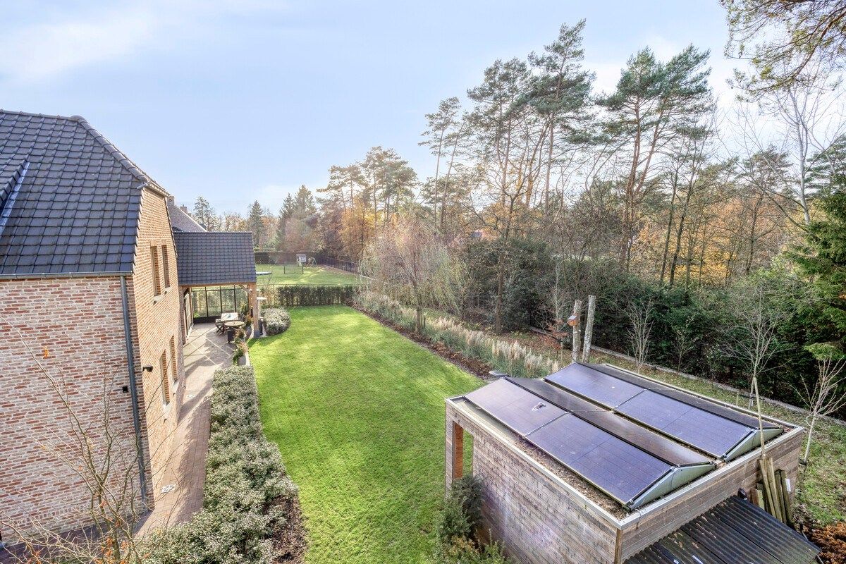 Ruim ingedeelde en kwalitatief afgewerkte villa op een mooi perceel met naastgelegen bouwgrond. foto 46