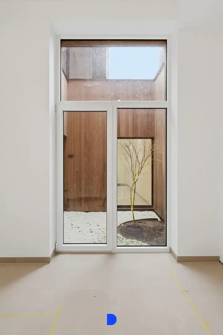 Stijlvol gerenoveerde woning met lichtrijke leefruimtes en tuin foto 13