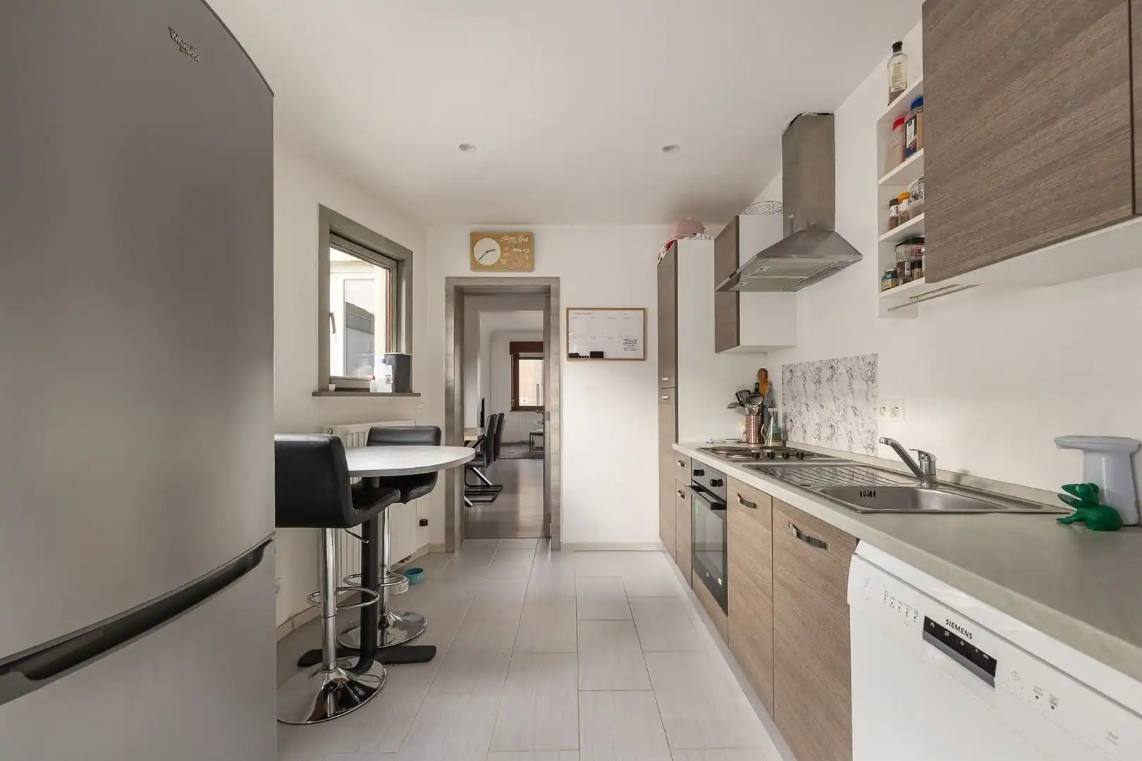 Woning met privé-staanplaats voor de deur foto 3