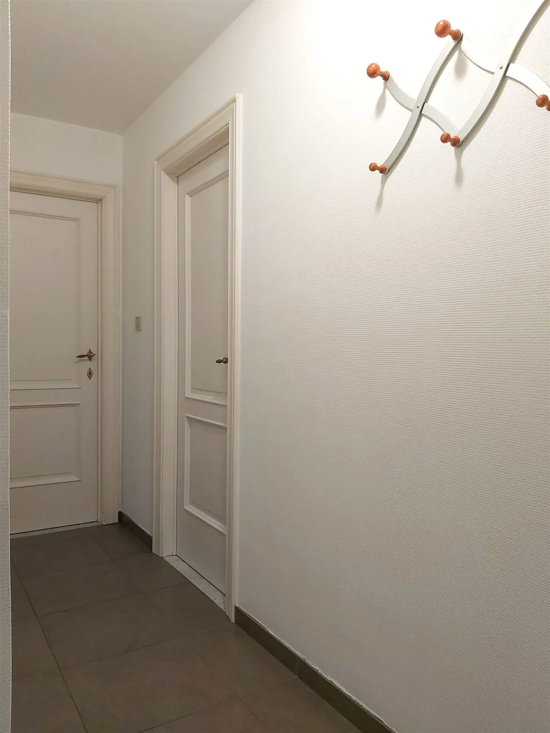 Gelijkvloers appartement met 2 slaapkamers, autostaanplaats en kelderberging in Maasmechelen! foto 8