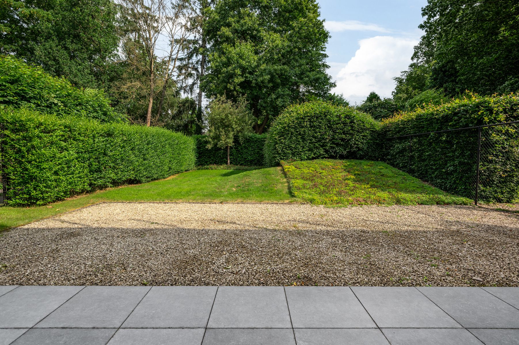 Luxe gelijkvloersapp. met ondergrondse parking en tuin. foto 29