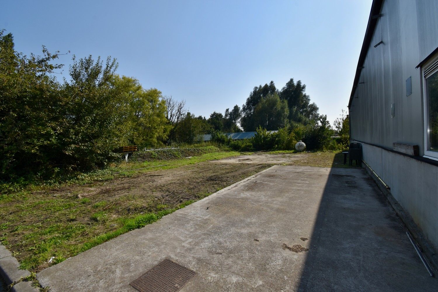 Polyvalent gebouw bestaande uit winkelruimte, appartement en loods foto 47