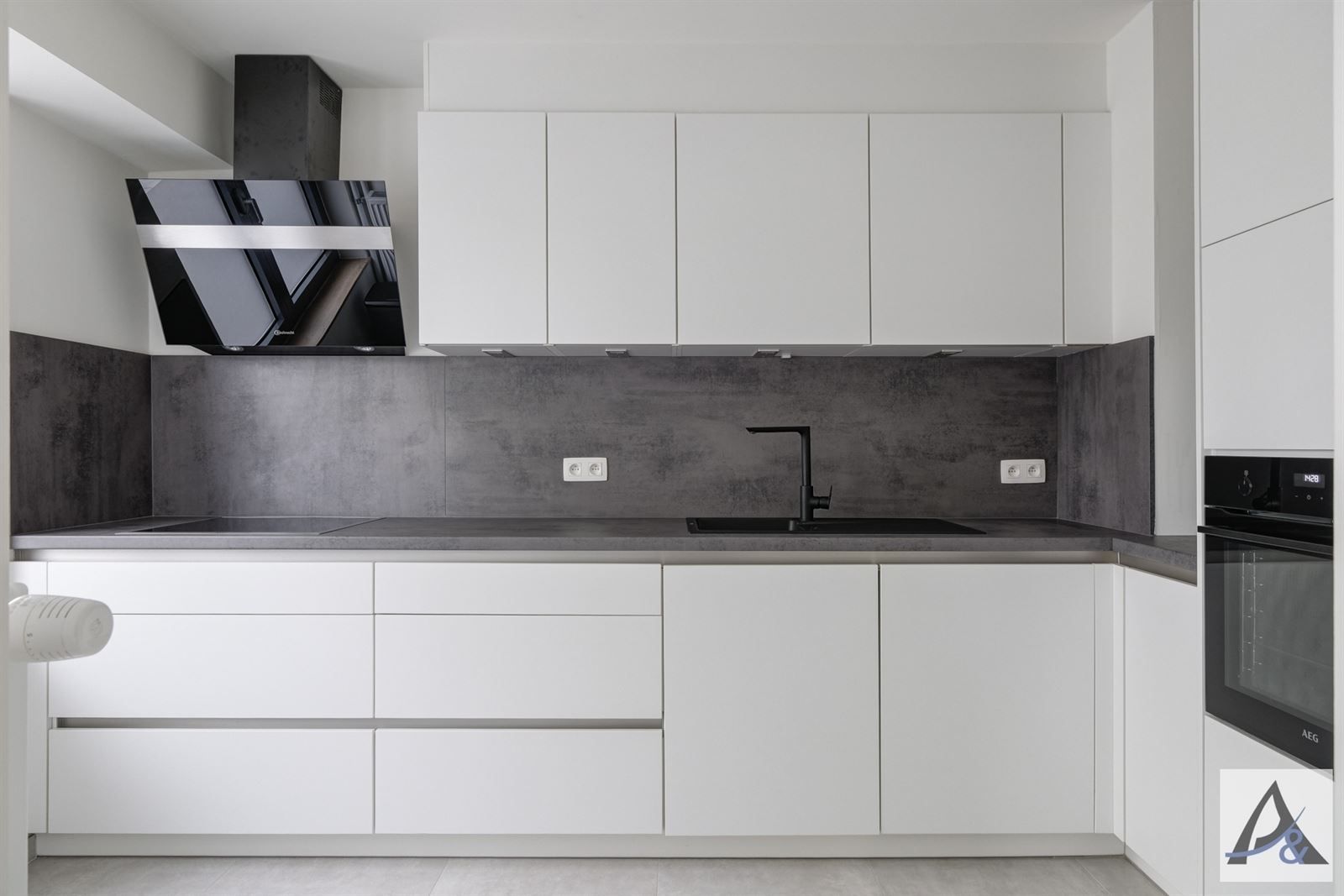 Instapklaar gelijkvloers appartement in hartje Bilzen met garage foto 12