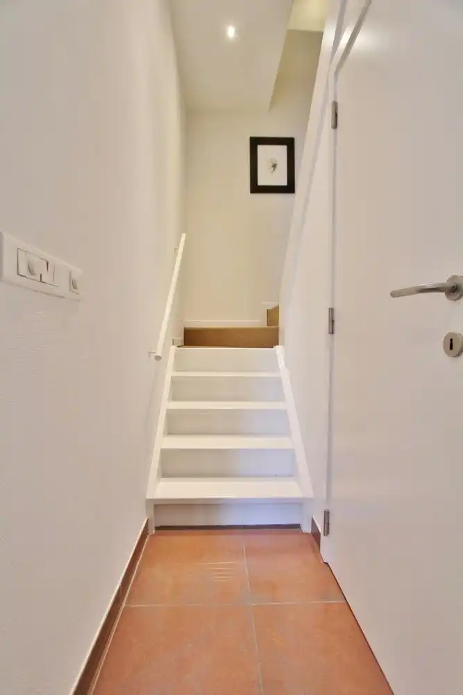 Gezellige triplex op toplocatie met 2 slaapkamers, terras en ondergrondse autostaanplaats foto 6