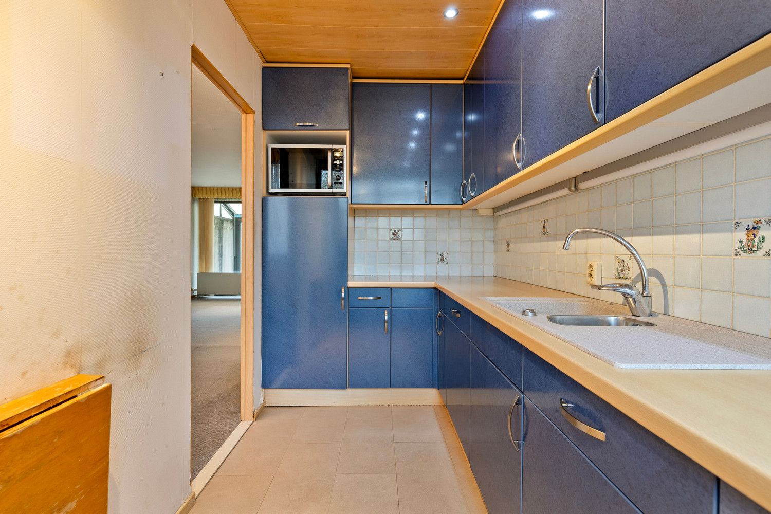 In de wijk 'Langbaanvelden' ligt deze te renoveren bel-étagewoning met 3 tot 4 slks, garage en tuin! foto 15