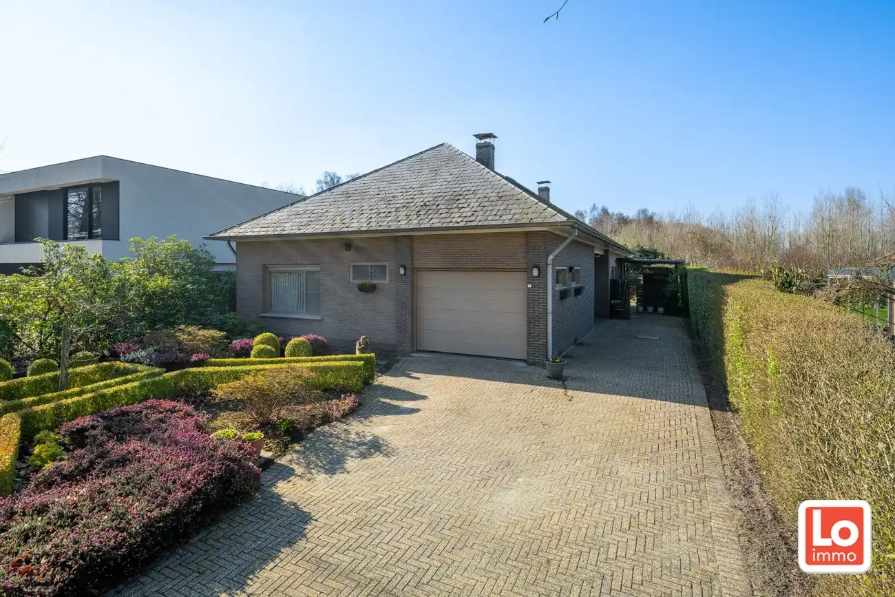 Degelijke open gelijkvloerse woning met inpandige garage en grote tuin op een groene toplocatie in Beervelde! foto 7