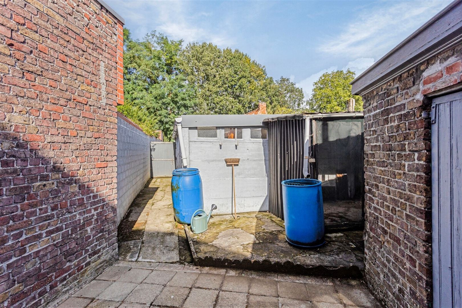 Te renoveren woning met tuin en toegang achteraan. foto 26