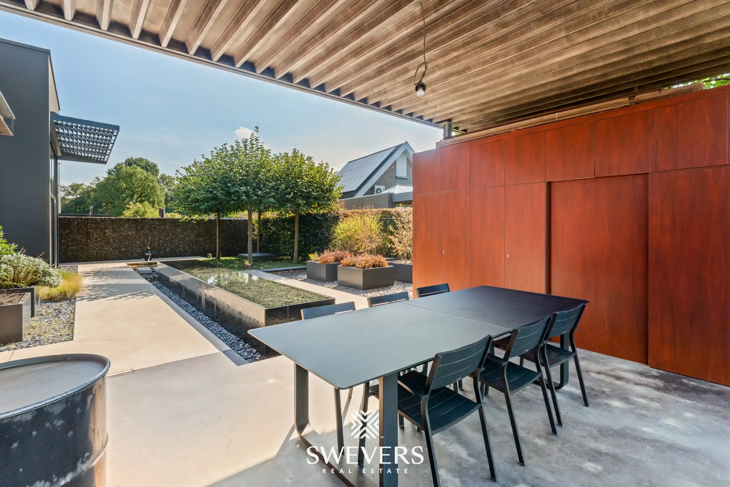 Instapklare woning met prachtig aangelegde tuin en overdekt terras foto 23