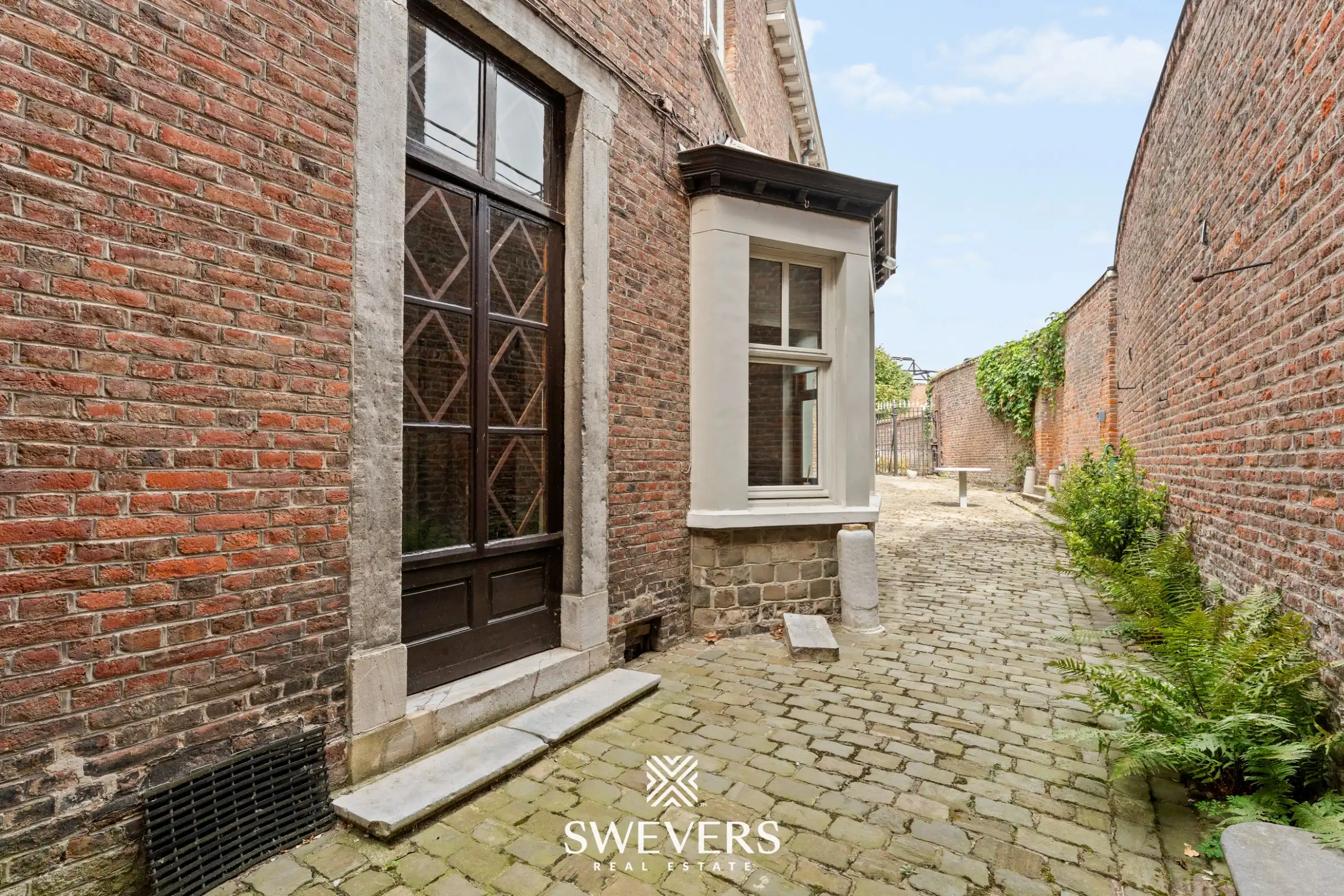 Karaktervol herenhuis met 346 m² woonruimte en uitzonderlijk renovatiepotentieel in centrum Borgloon foto 48