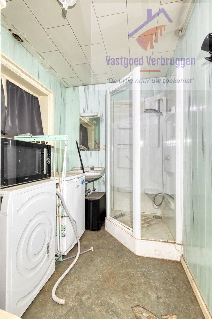 Ruime statige halfopen bebouwing met mooie tuin nabij het centrum foto 22