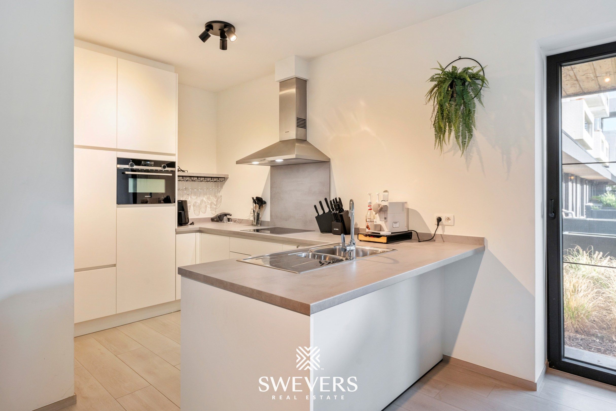 Instapklaar, energiezuinig gelijkvloers appartement (99 m²) met garage en kelders in het pittoreske Bolderberg foto 11