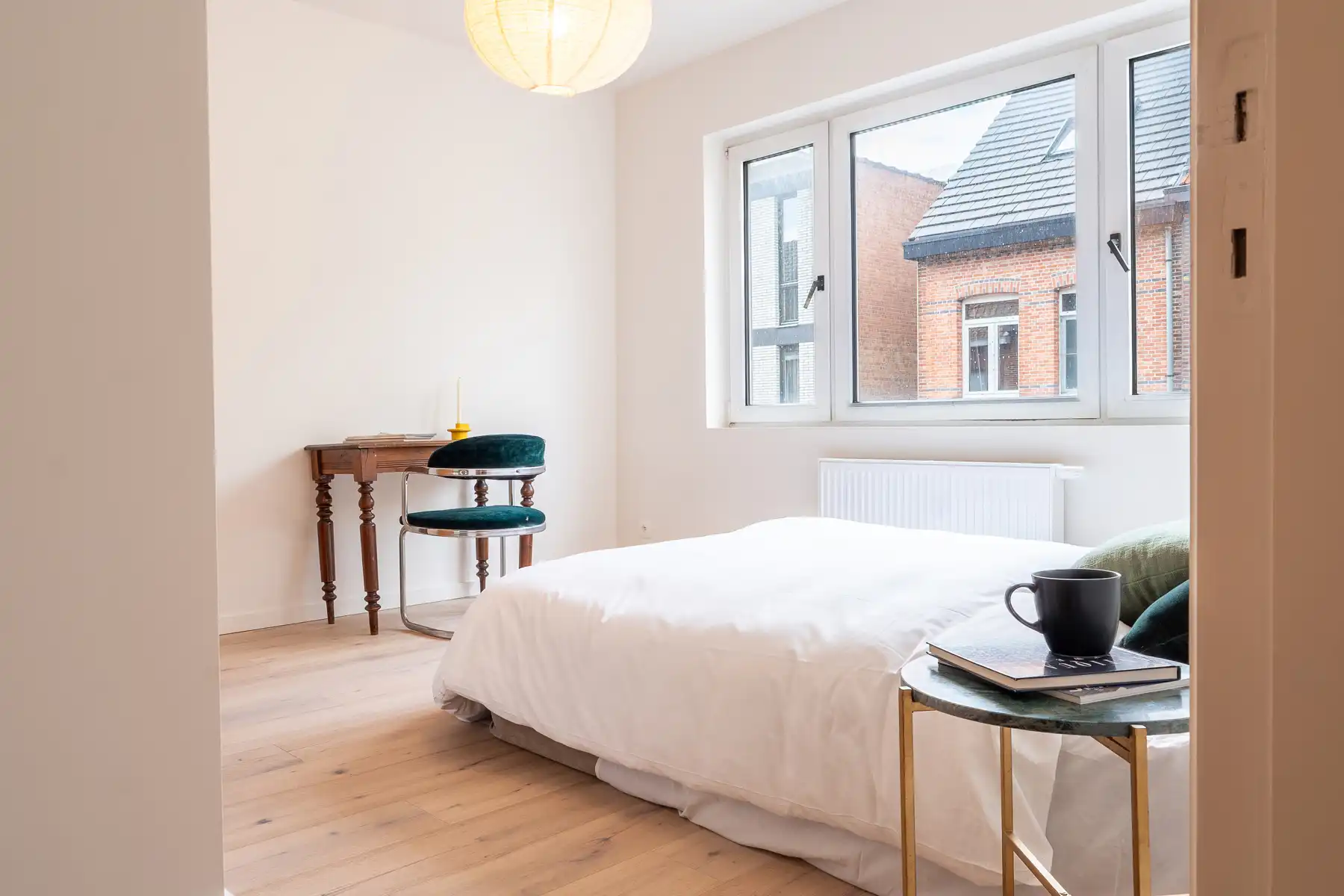 Opbrengsteigendom met 3 appartementen, tuin en garagebox foto 9