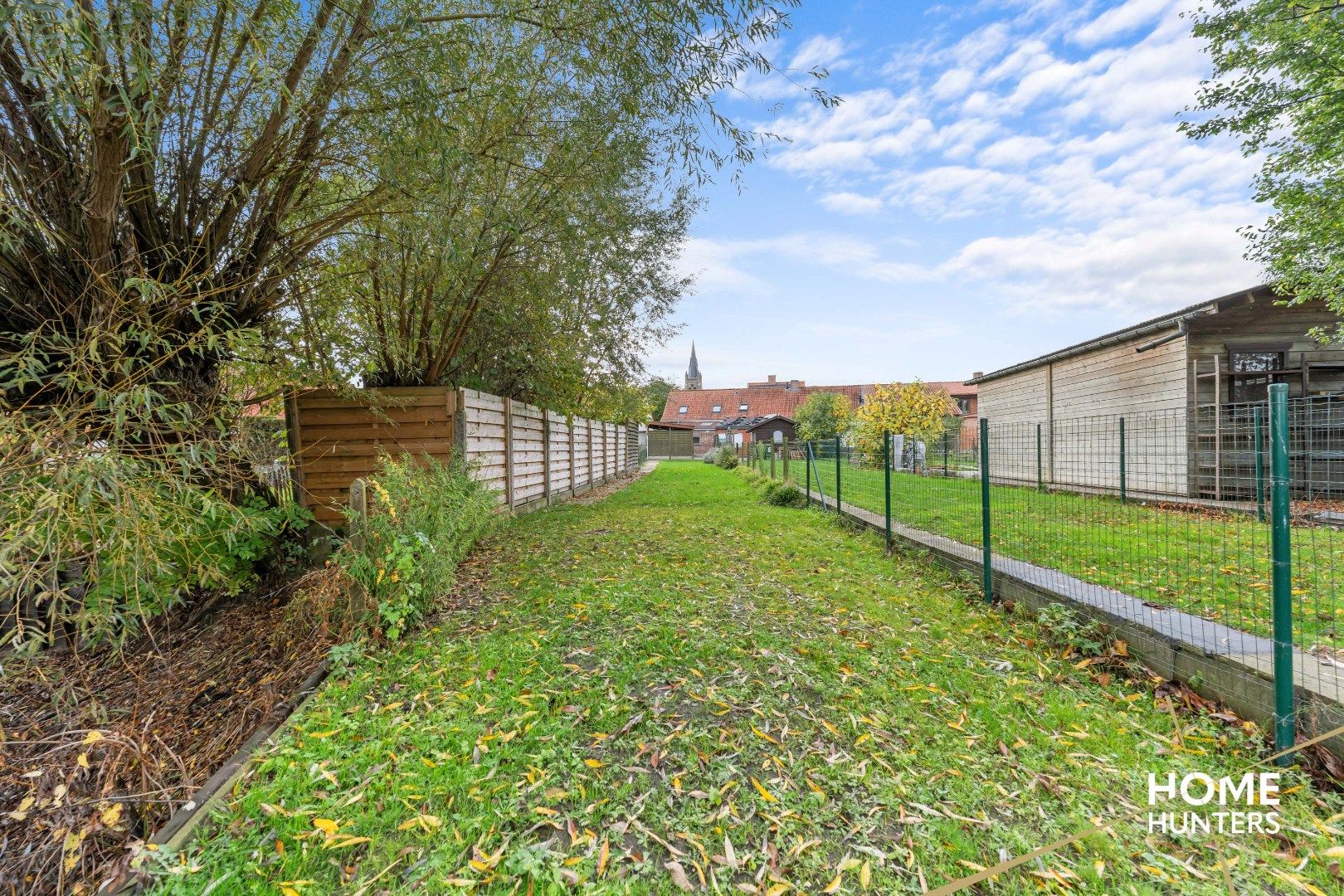 Halfopen gezinswoning met 3 slpks, carport en diepe tuin in Dikkebus foto 9