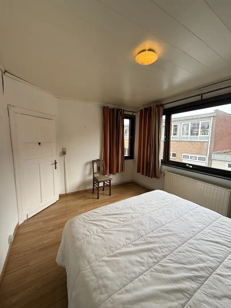 Opbrengsteigendom bestaande uit 2 halfopen woningen met garage en tuin te Hechtel. foto 14