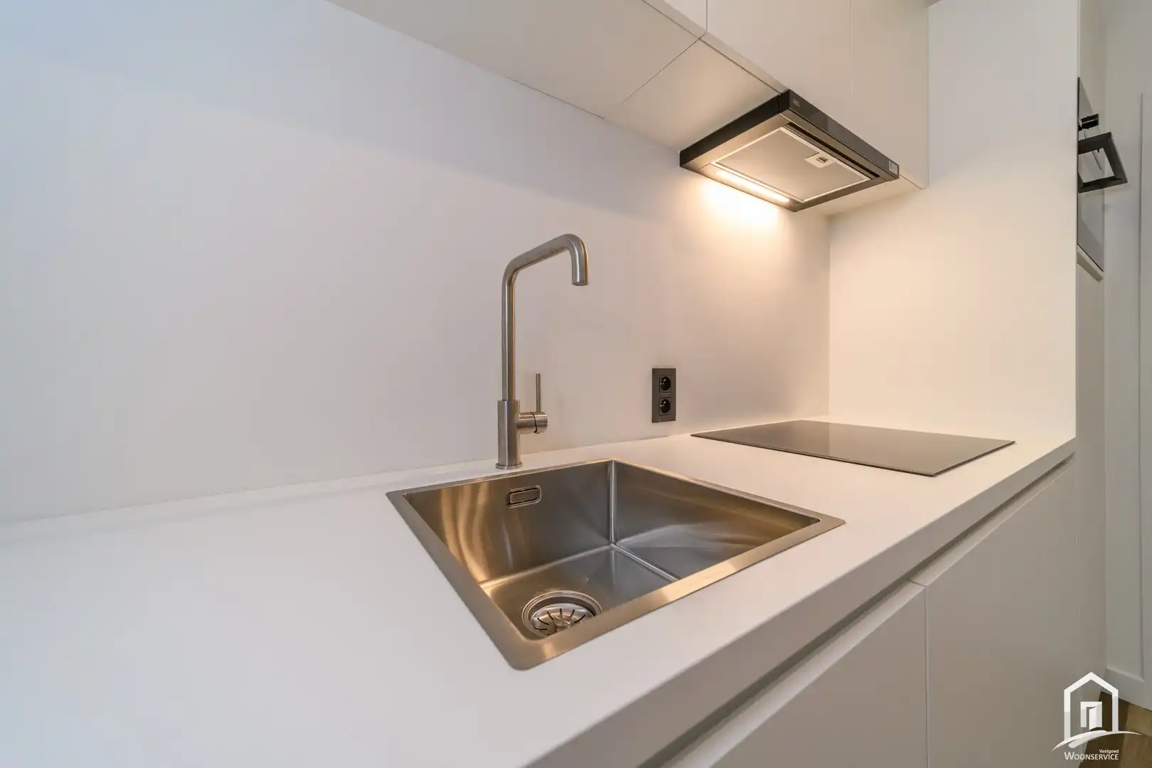 Totaal gerenoveerd gelijkvloers-appartement met tuintje foto 10