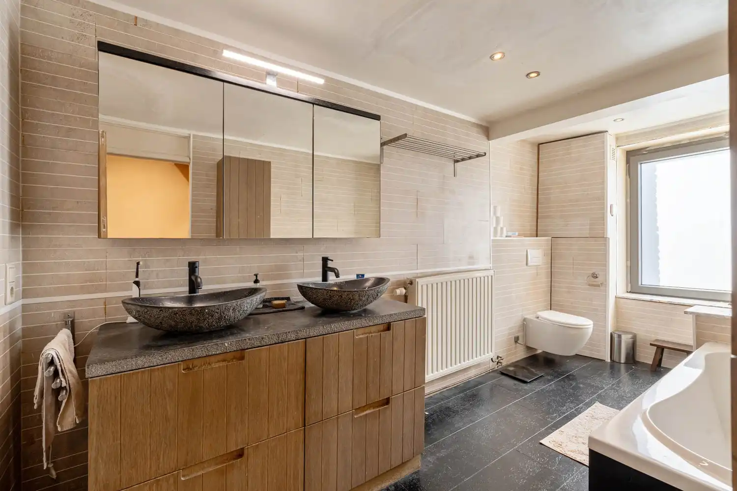 Goed gelegen halfopen bebouwing met 3 slaapkamers en een tuin met een poortje naar de straat te Wilsele! foto 18