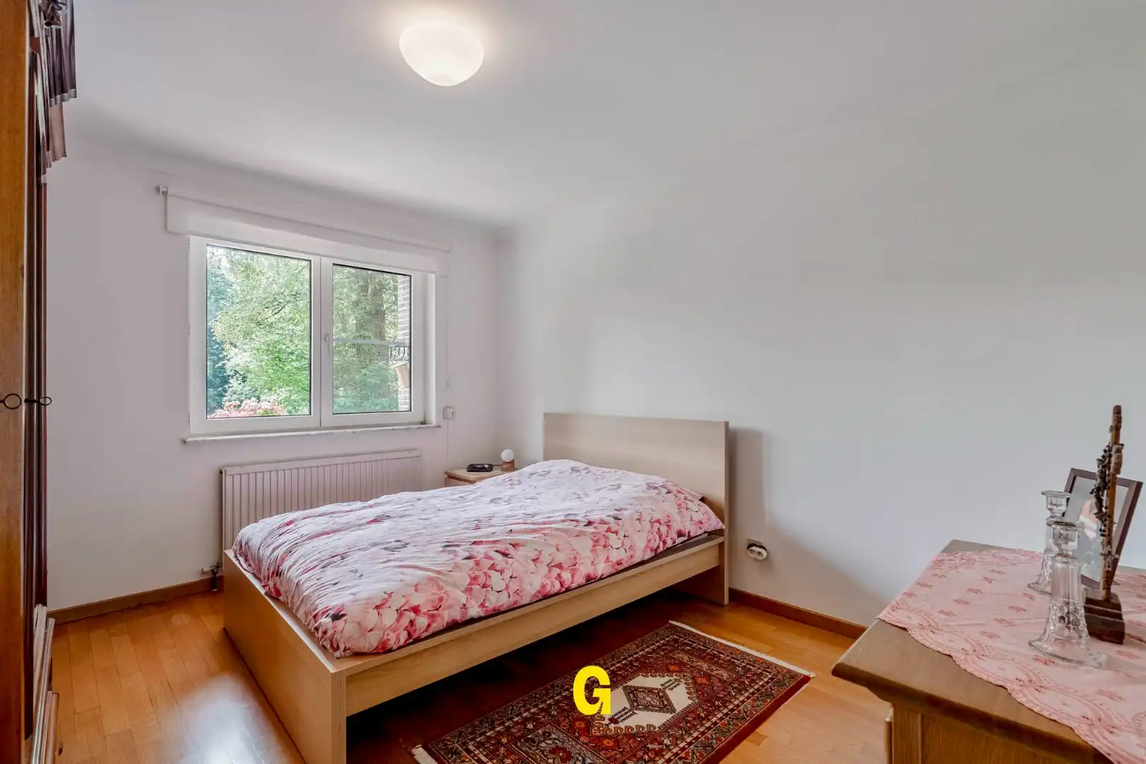 Uitstekend verzorgd 2-slaapkamer appartement in hartje Bilzen, met standplaats, kelderberging en terras met zicht op het Park van Haffmans foto 20