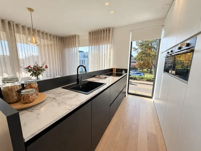 Luxueus designappartement met zuidterras, carport en ruime kelder foto 5