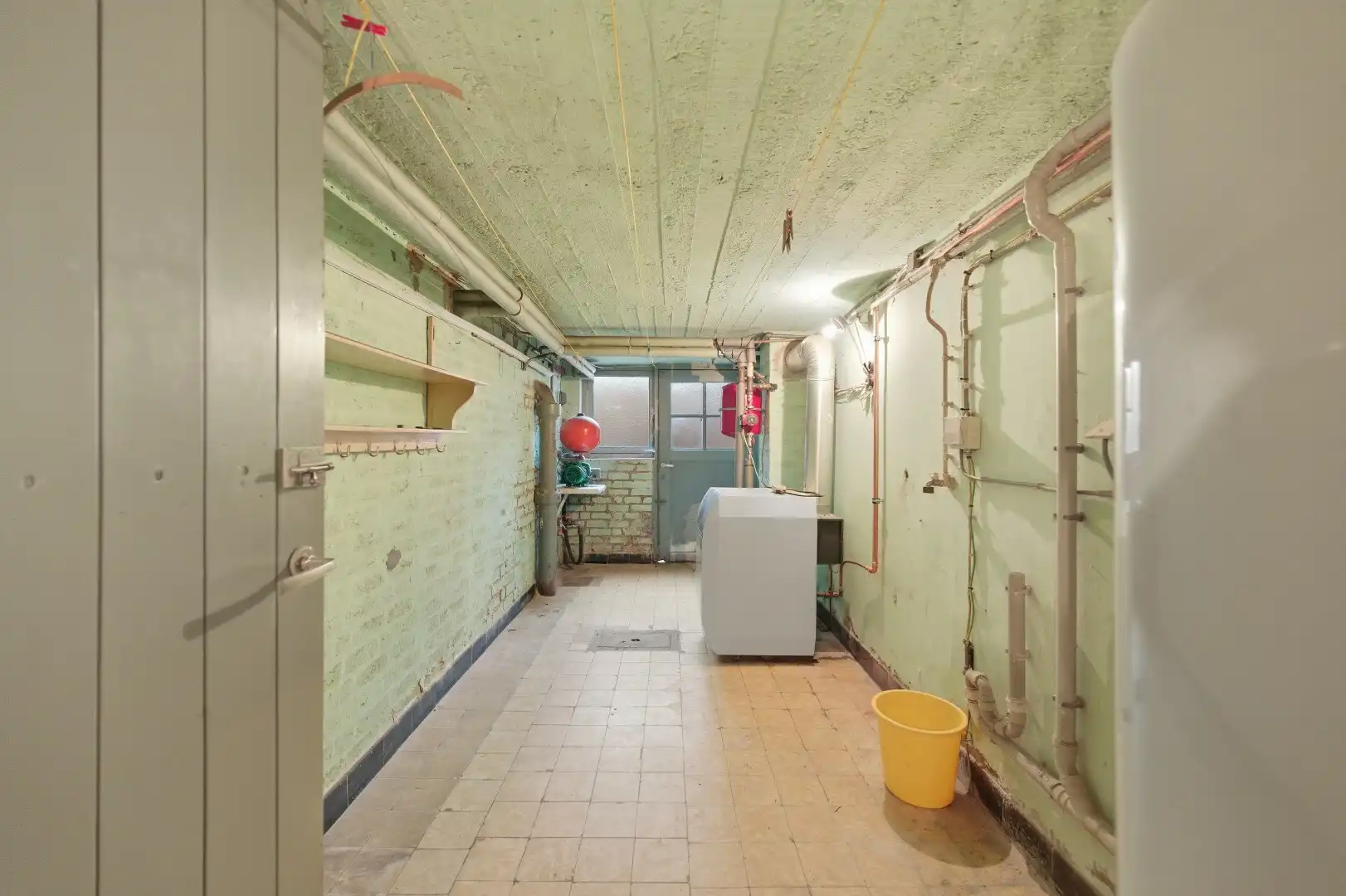 Op te frissen rijwoning met 2 slaapkamers en ruime tuin in Tienen foto 17