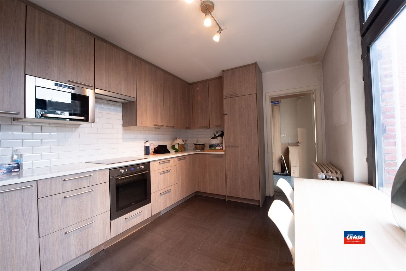 Handelshuis met groot appartement, garage en tuin foto 13