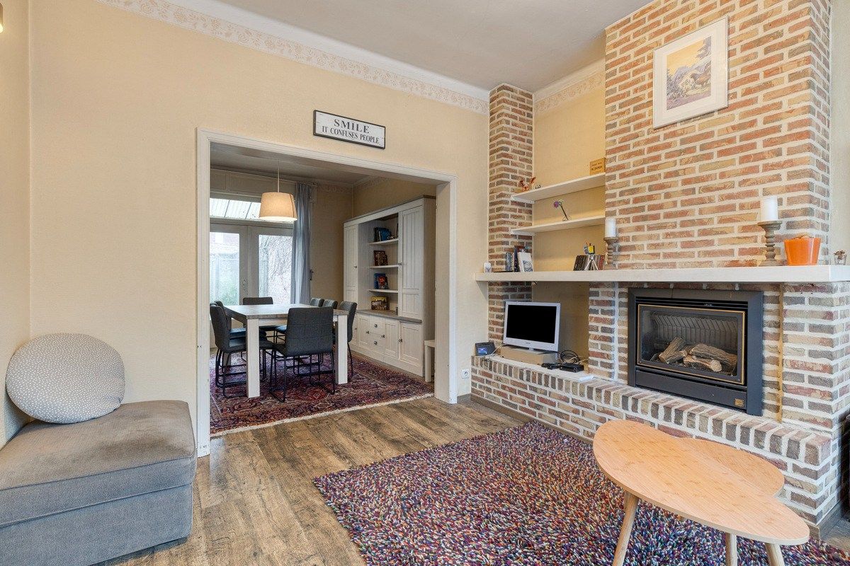 Charmante op te frissen woning met 4 slaapkamers en stadstuintje! foto 3