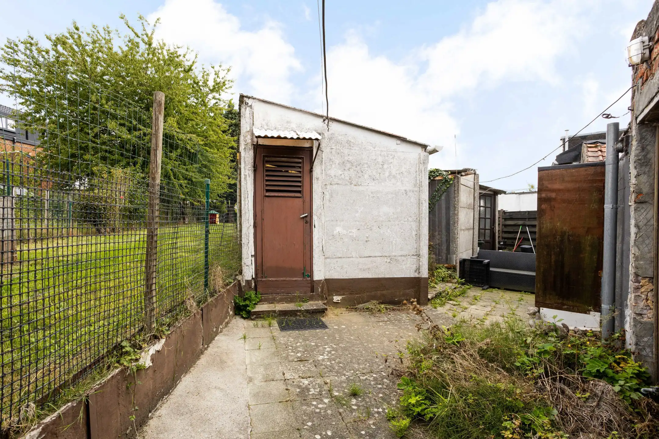 Te renoveren woning met aangename stadstuin foto 19