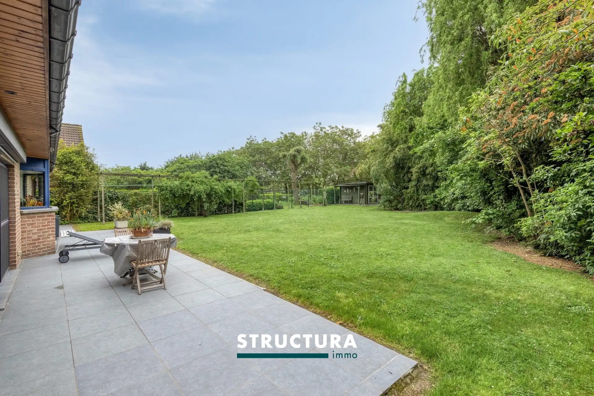 Gezinsvilla op topligging met prachtige ZW tuin foto 12