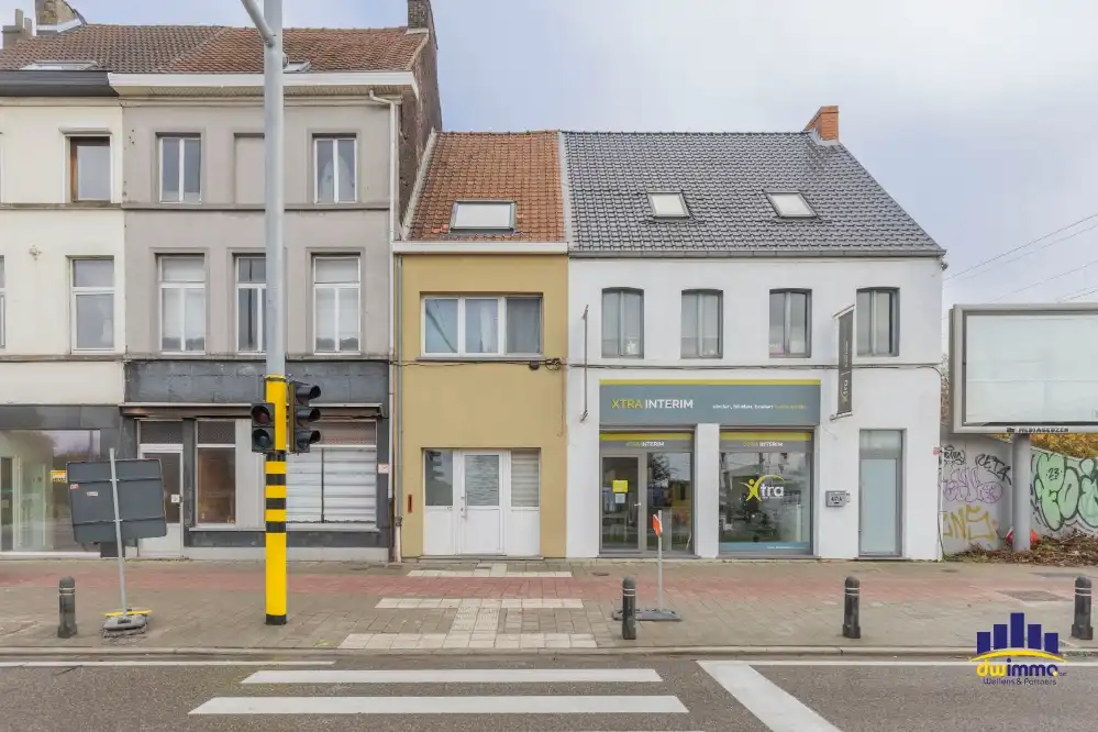 Te koop: grondig op te frissen woning met tuin in Gentbrugge foto {{pictureIndex}}