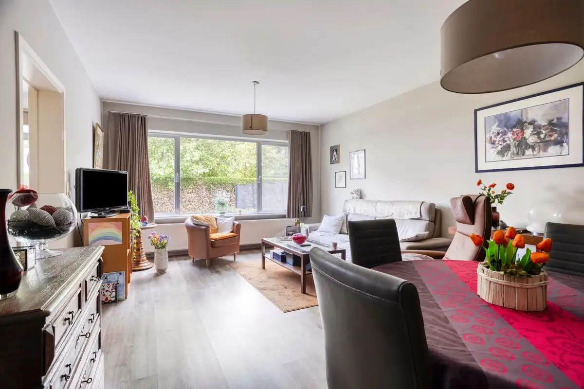 Opbrengsteigendom met 3 appartementen, garages en tuin foto 4