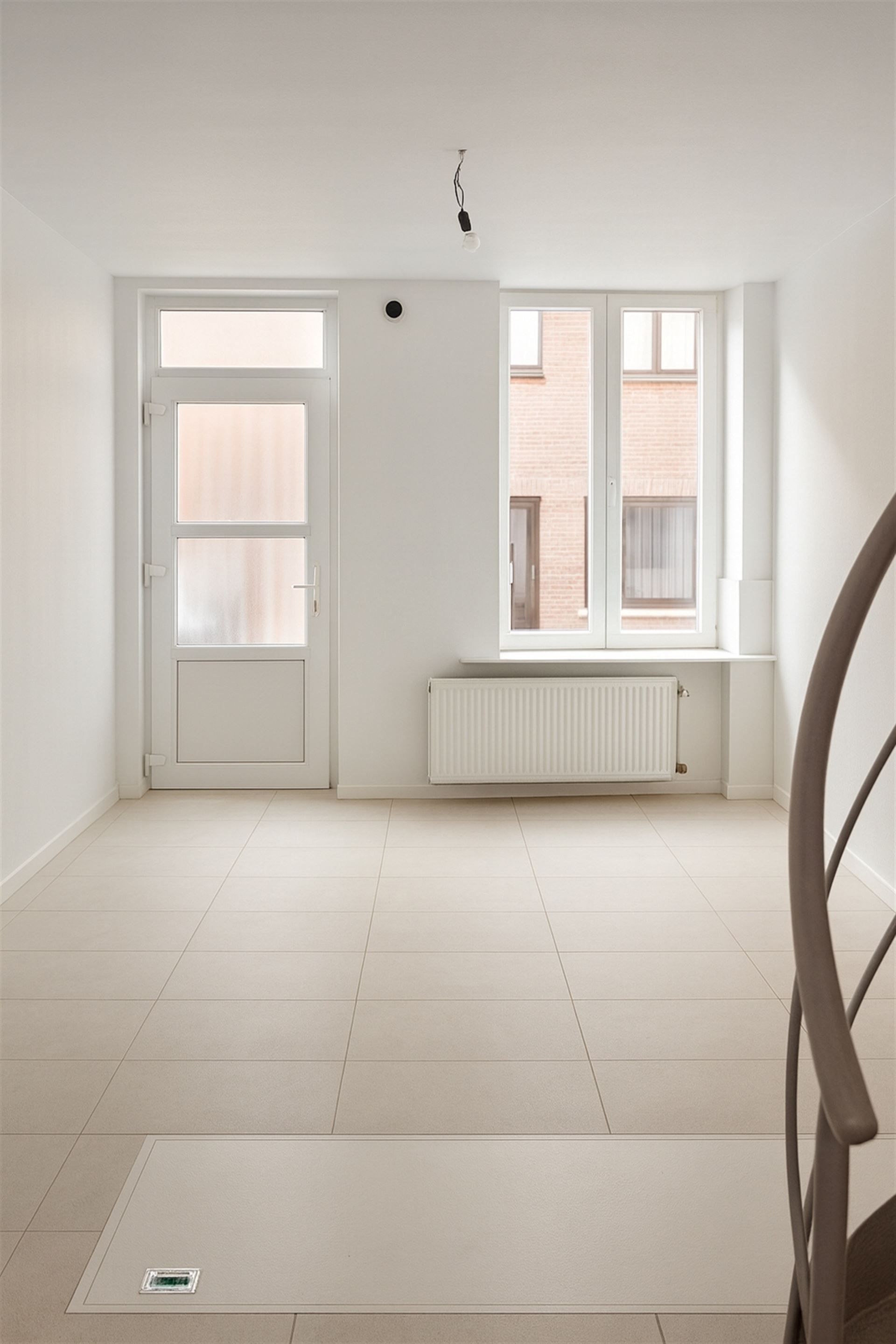 Instapklare stadswoning met 2 slpks en buitenruimte! foto 2