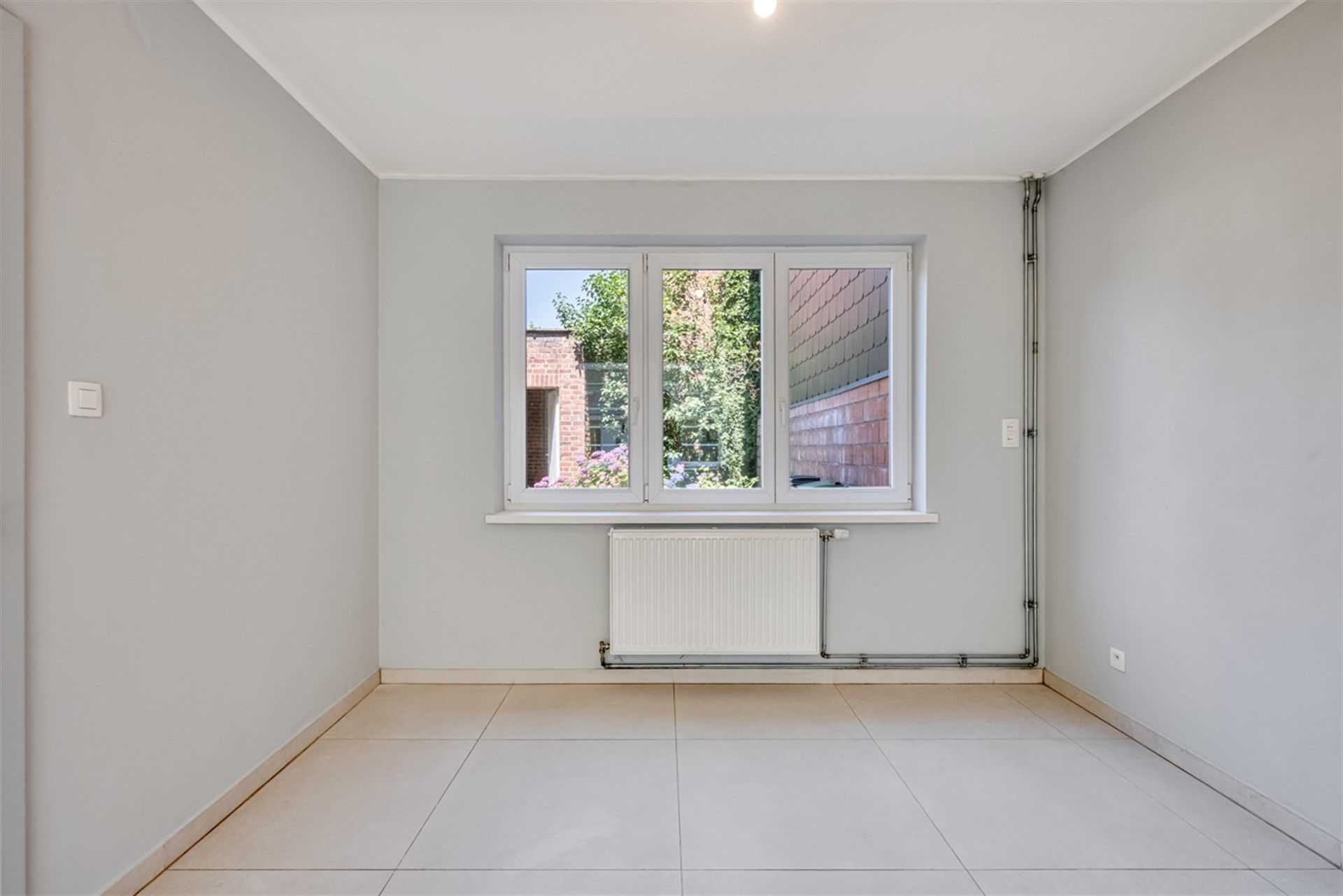 Ruime stadswoning met drie slaapkamers en tuin in centrum Aalst foto 7