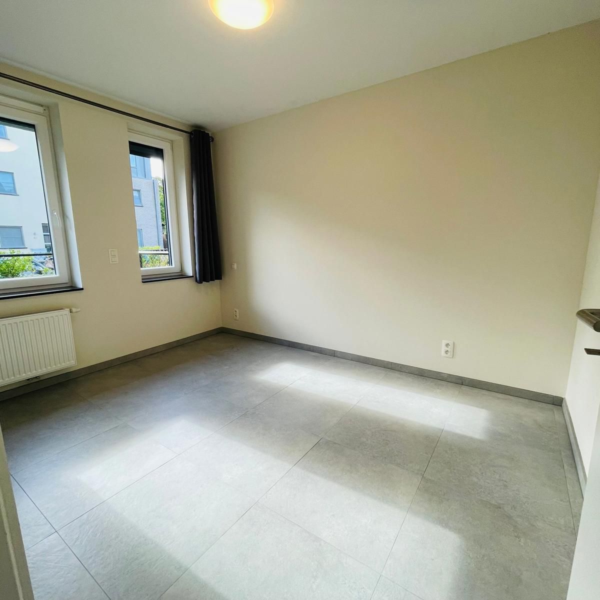 Gelijkvloers 2 slpk-appartement met tuintje foto 9