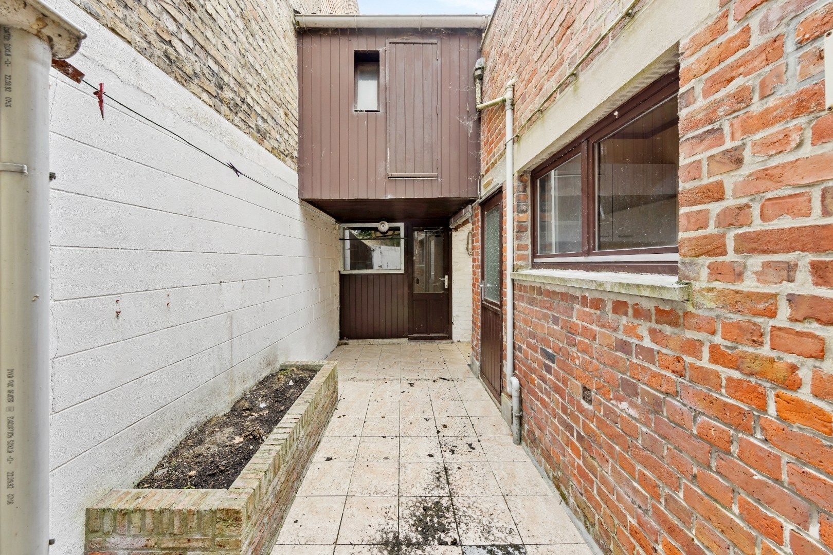 Gezellige stadswoning met 4 slaapkamers, ruime garage en koertje. foto 7