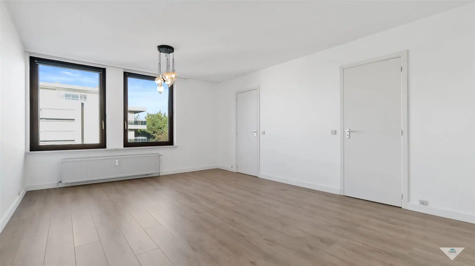 Lichtrijk appartement met garagebox foto {{pictureIndex}}