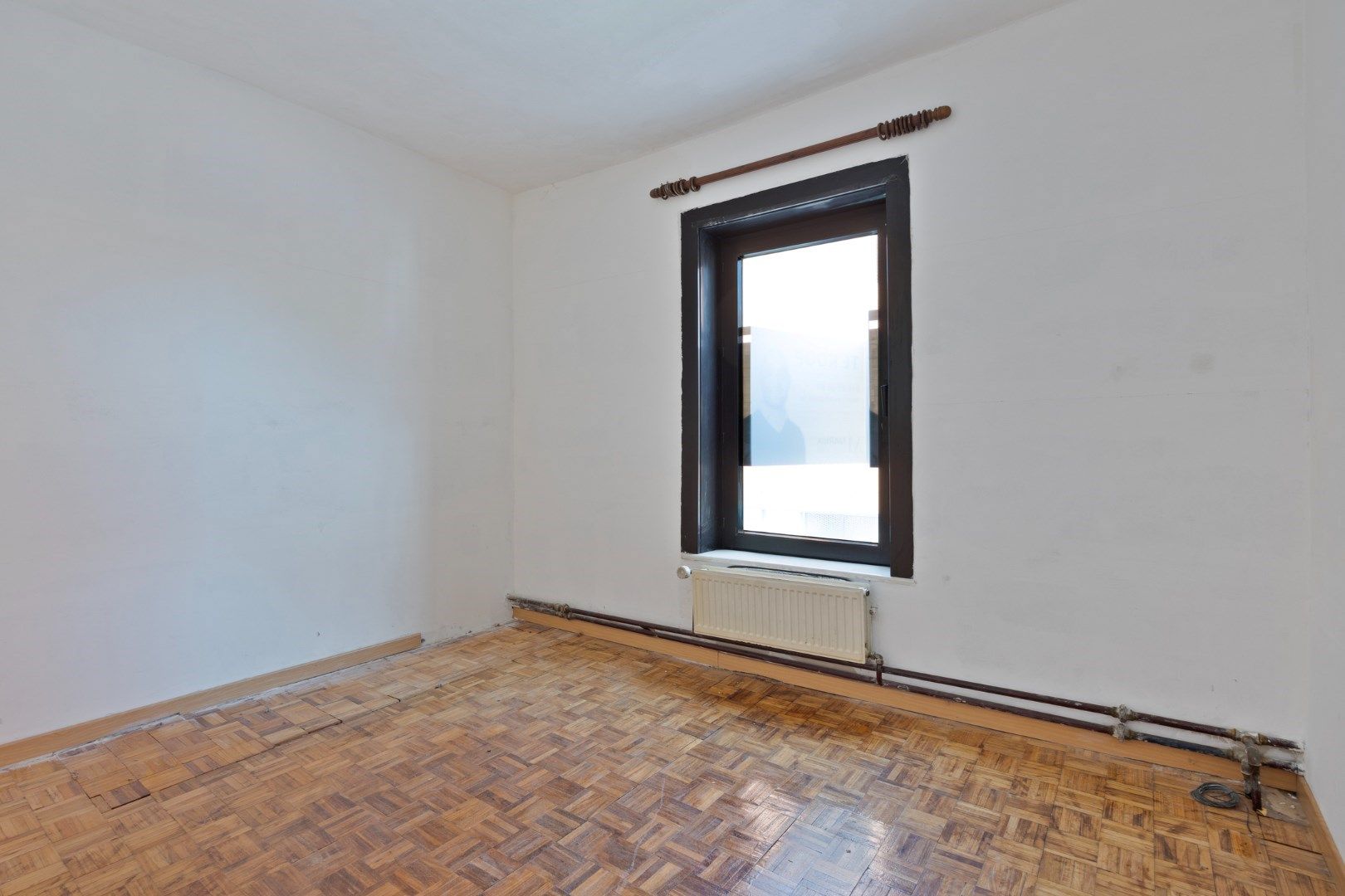 Halfopen hoekwoning met garage en dakterras op toplocatie in Kessel-Lo – renovatieproject met veel potentieel foto 24