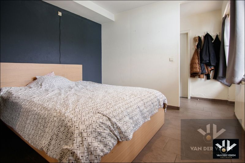 Instapklaar gelijkvloers appartement met ruime tuin te Tuilt foto 12