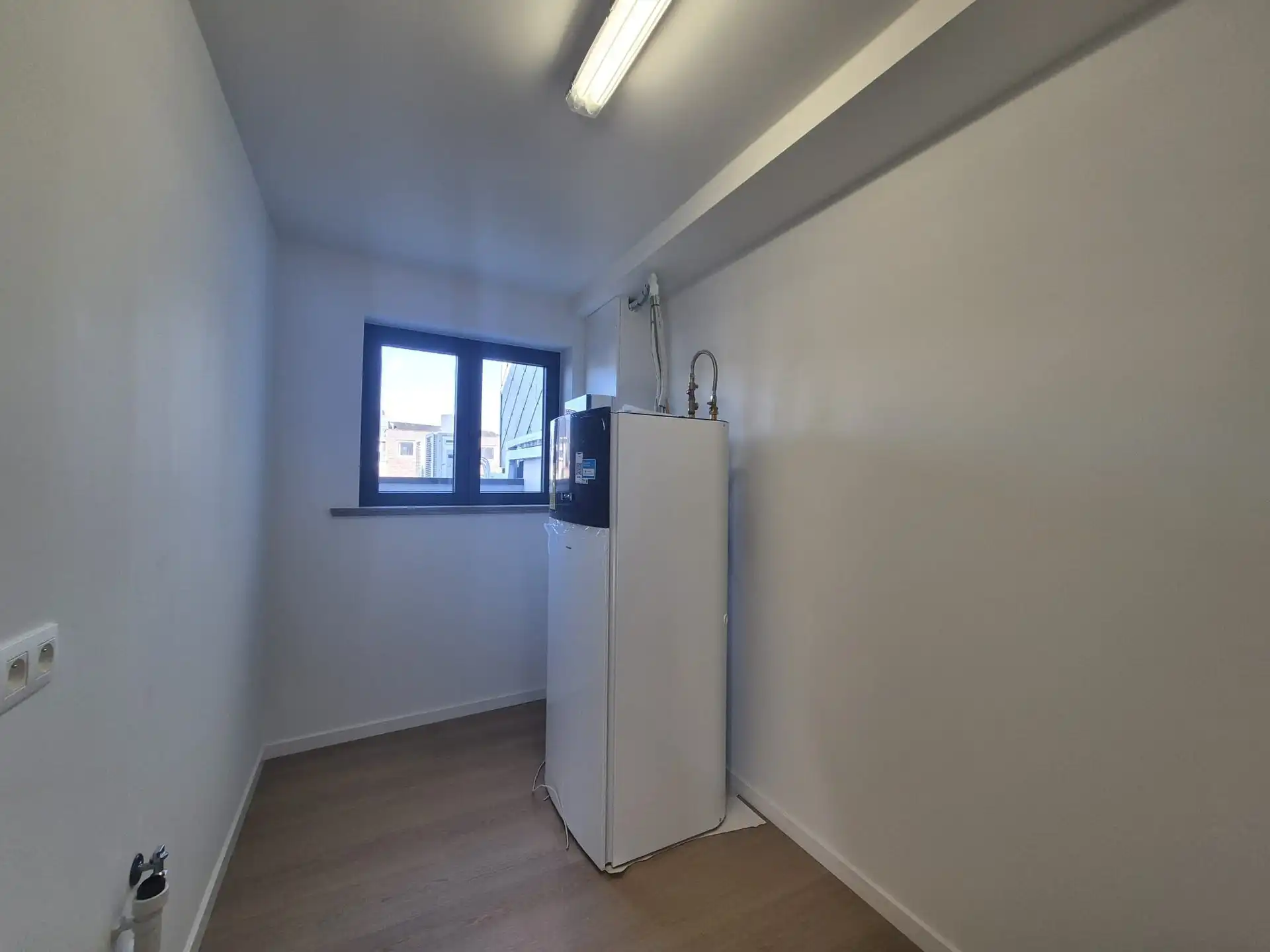 Ruim triplex appartement met polyvalente ruimte op toplocatie in het hart van Wetteren foto 24