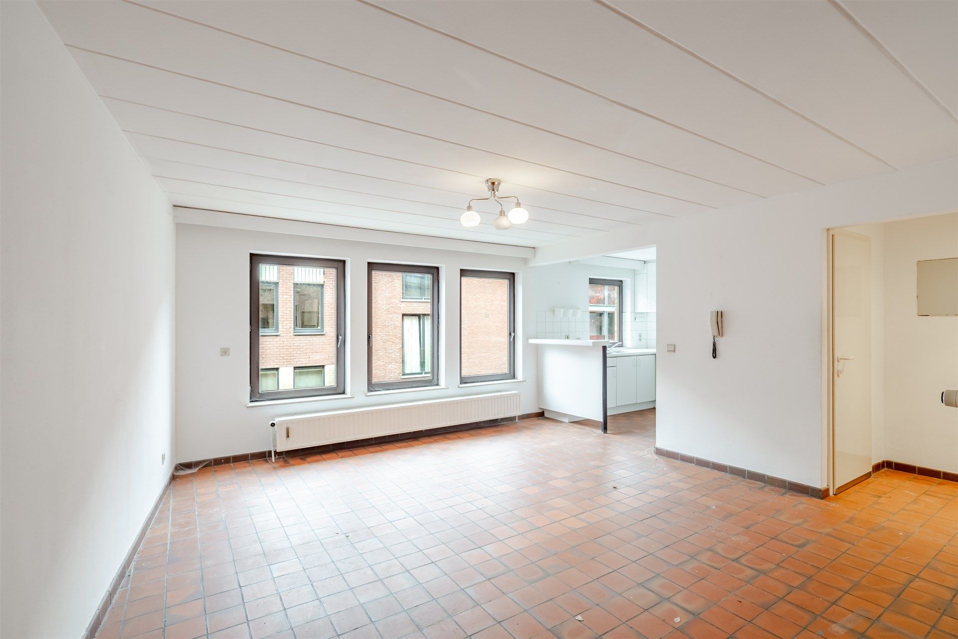 Opbrengsteigendom bestaande uit 4 appartementen + 22 garageboxen + magazijn/werkplaats foto 4